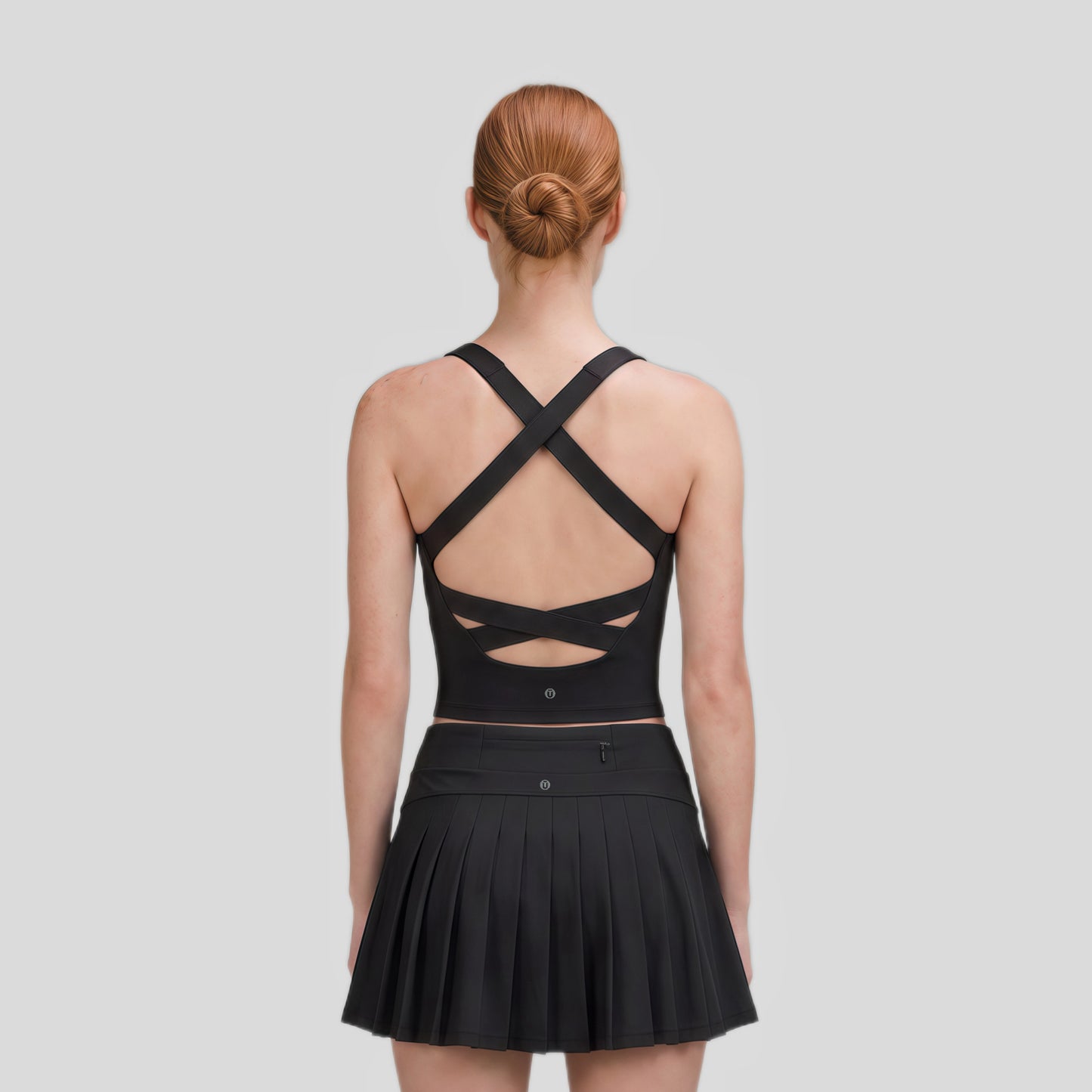 Falda deportiva plisada con bolsillo trasero
